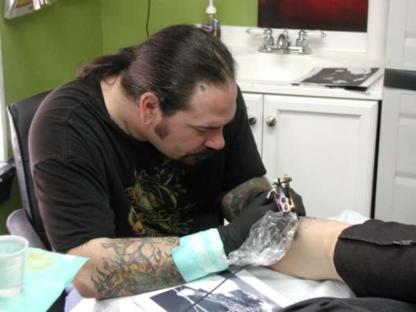 Dwaine Shannon working his magic tattoo