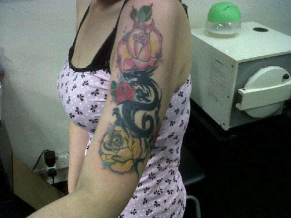 My dragon and 4 roses. tattoo
