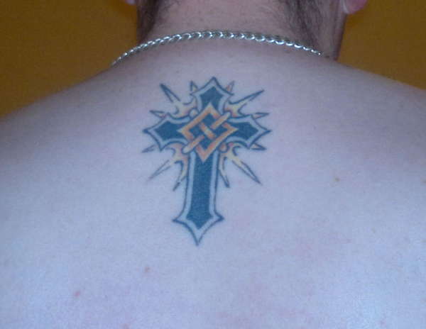 cross between my shoulders tattoo