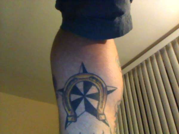 horseshoe and nautical star tattoo