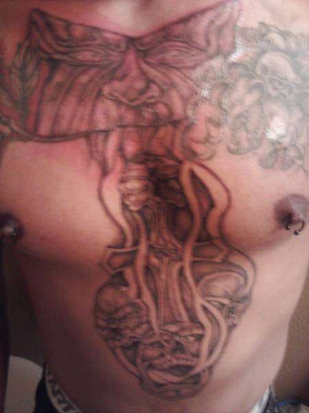 kennys chest piece/ in process. skulls flowers demons tattoo