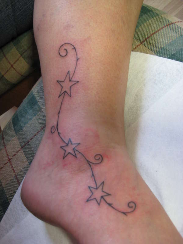 stars on foot tattoo