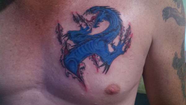 Chest dragon tattoo