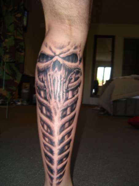Skull & spine tattoo