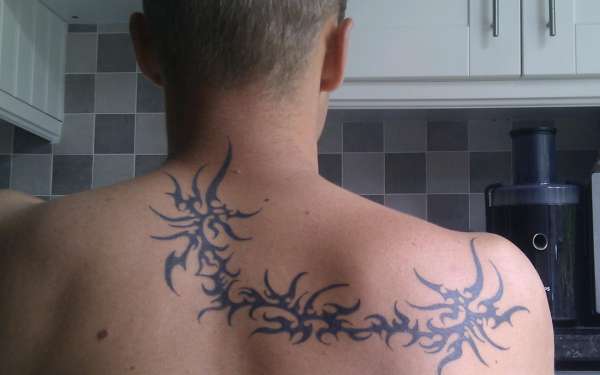 Upper back Tribal tattoo
