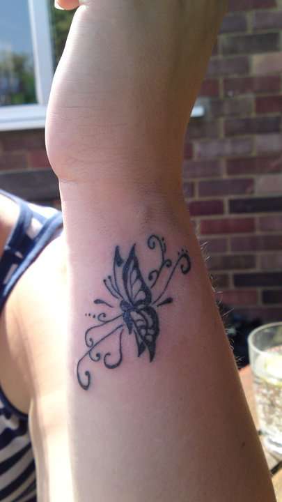butterly on wrist tattoo
