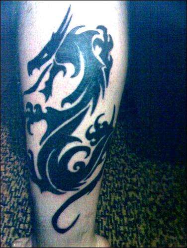 dragon on left leg tattoo