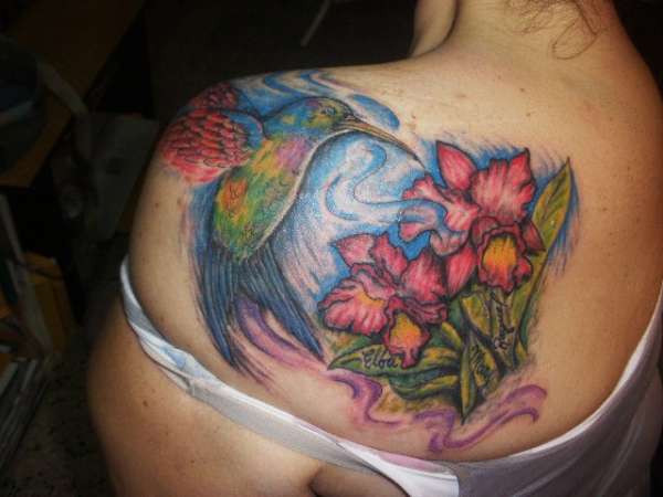 hummingbird flying with flowers tattoo