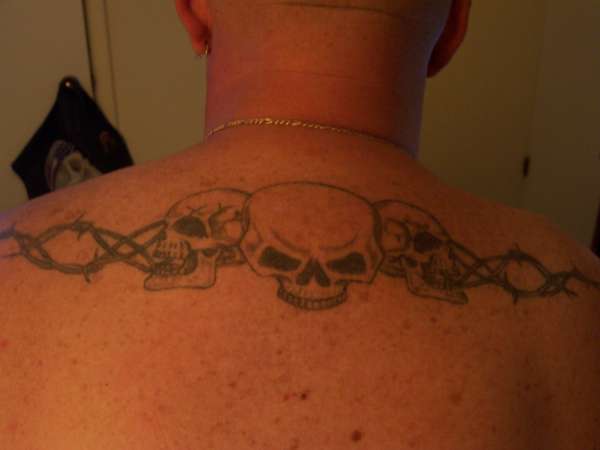 three skulls tattoo