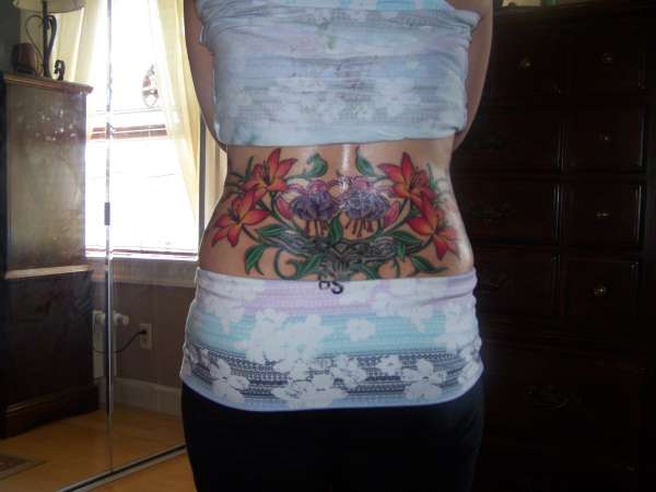 lower back flowers, vines and celtic tattoo