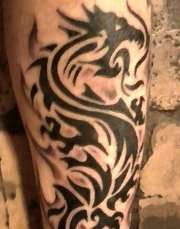 Dark tribal dragon tattoo