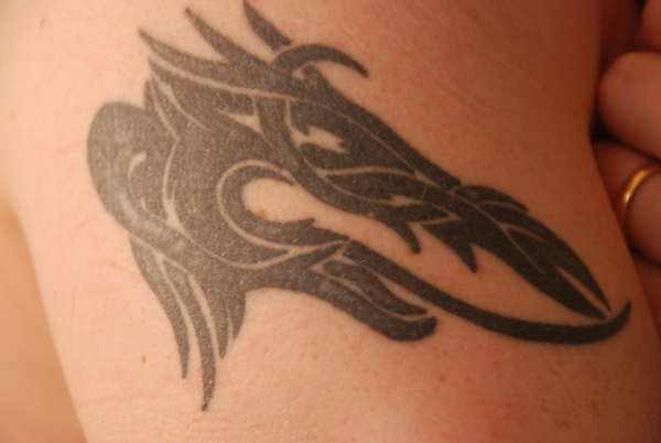 Tribal dragon head tattoo