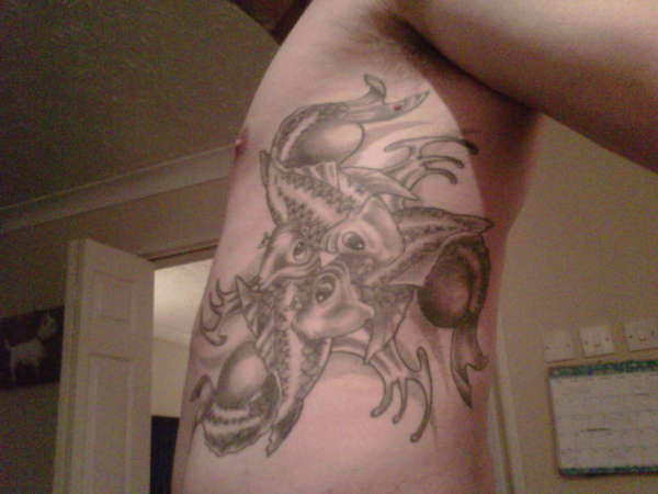 Triple Koi on ribs tattoo