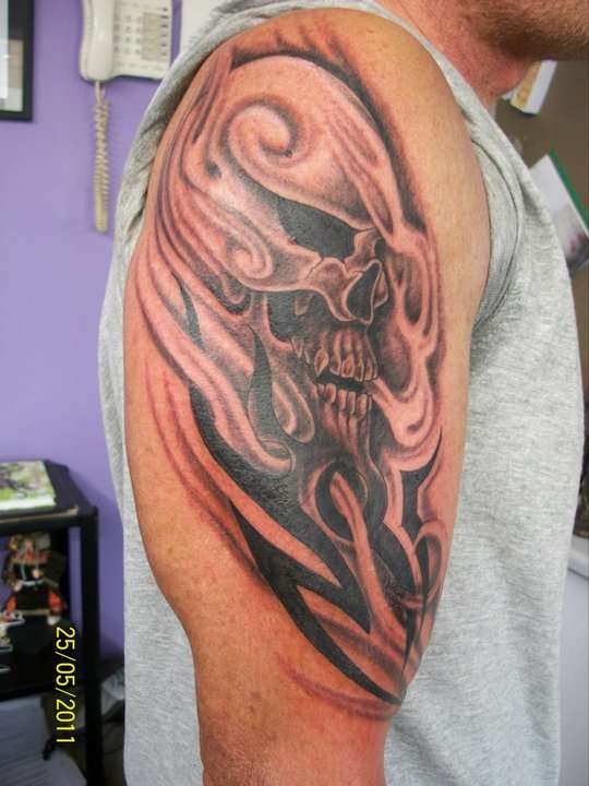 skull and tribal tattoo