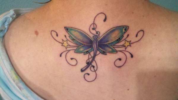 dragonfly on back tattoo