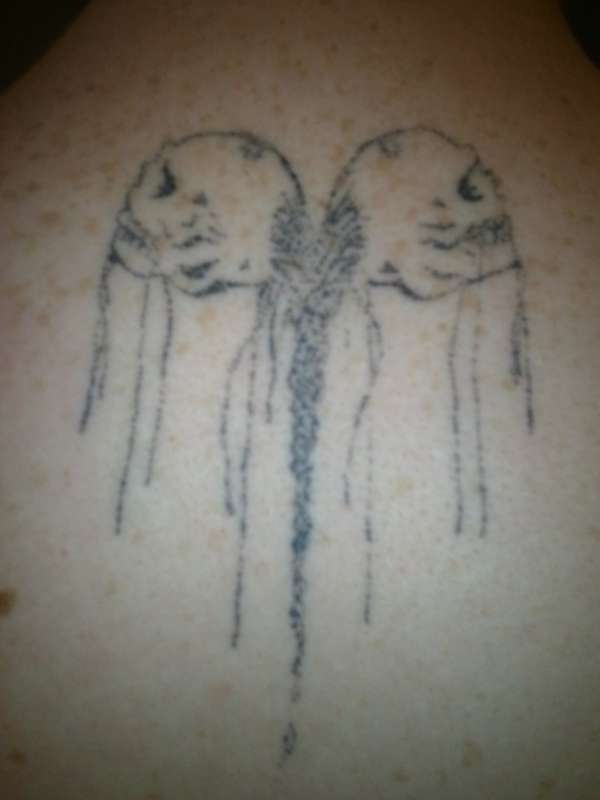 hand pushed skulls tattoo