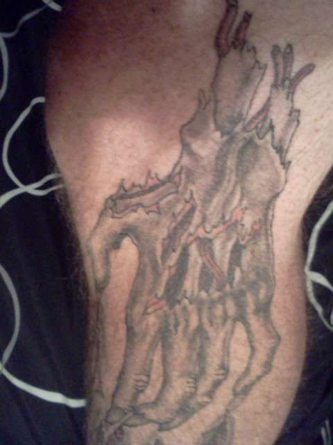 severed torn skin hand tattoo