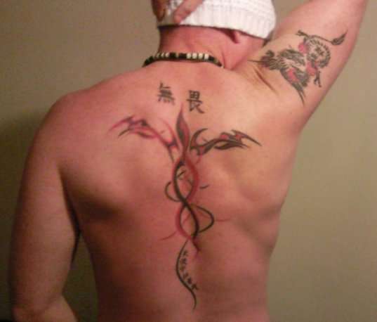 tribal back piece tattoo