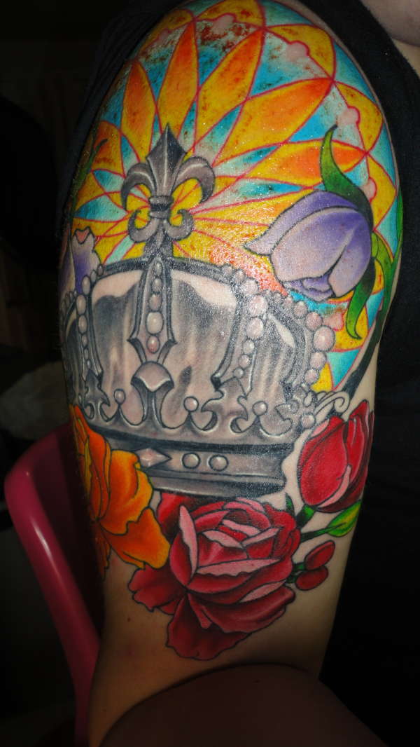 Crown and flower half sleeve tattoo