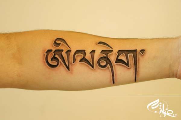 Tibetan lettering tattoo
