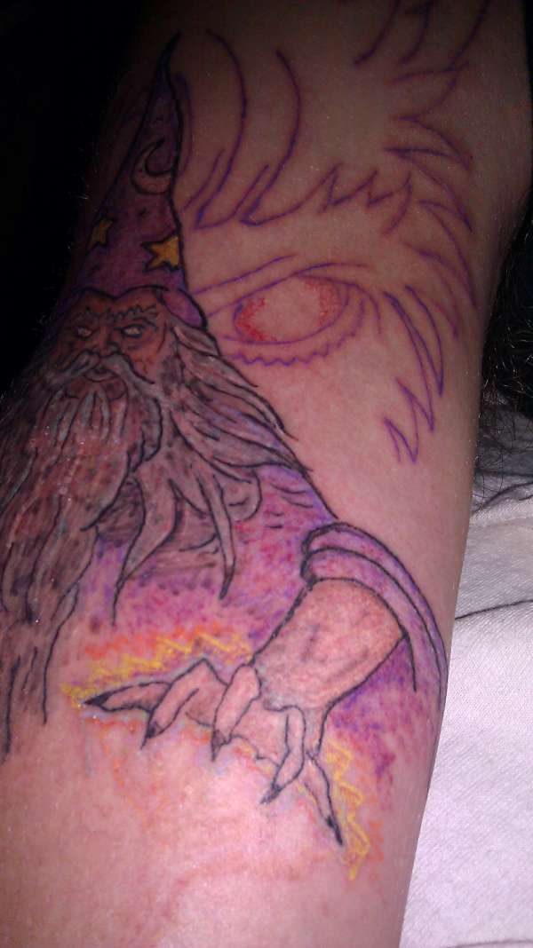 Unfinished wizard with sailor jerry demon behind tattoo