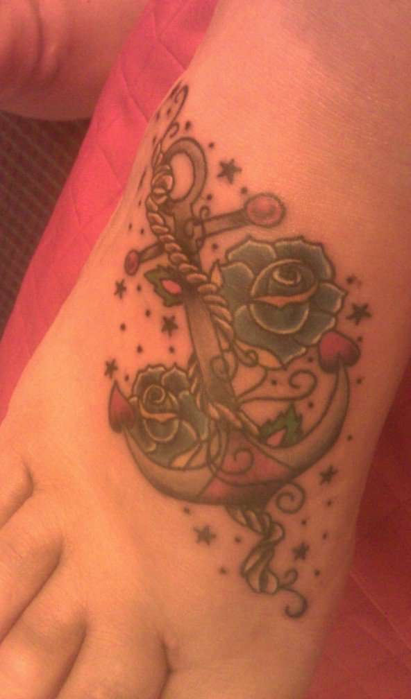 anchor and blue roses tattoo
