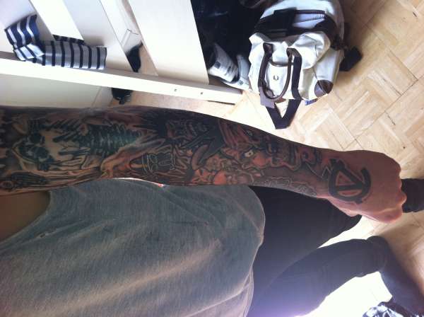 Left sleeve forearm tattoo