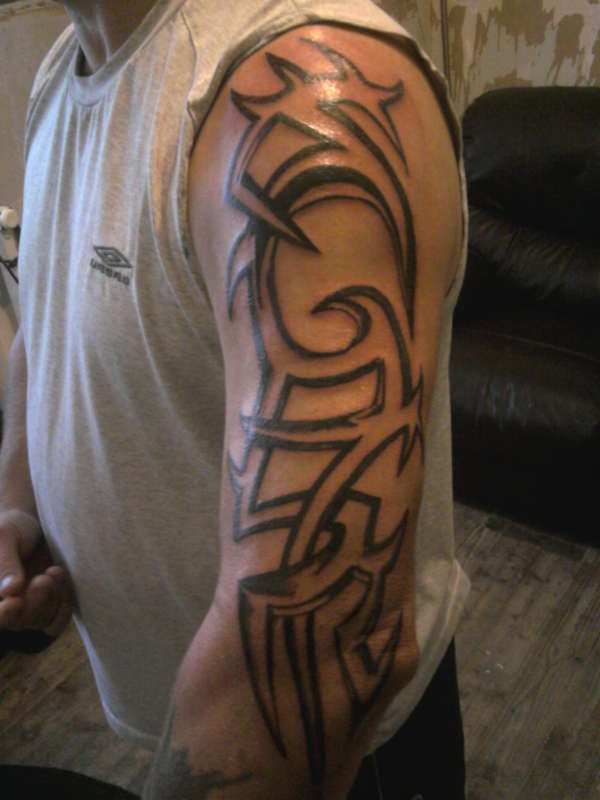 first full tribal arm tattoo