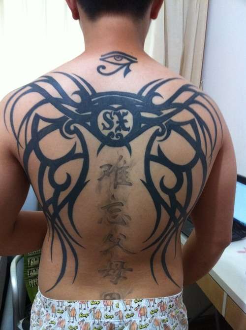 tribal wings w chinese words and eye of horus tattoo