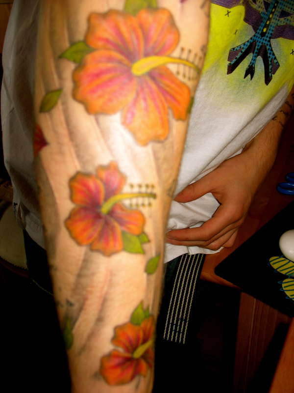 flowers on arm tattoo