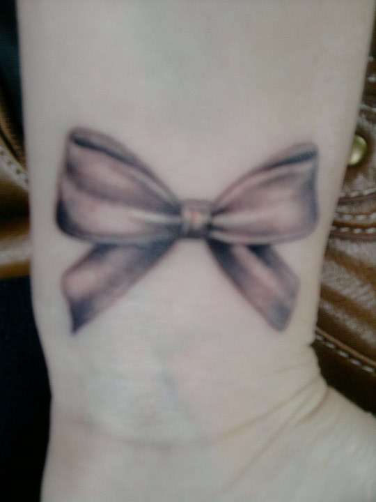 pretty little bow tattoo