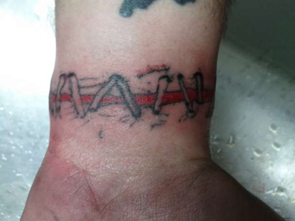 roped back on 1/2 done tattoo