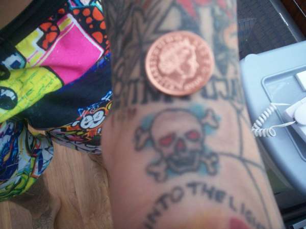 small skull and crossbones tattoo