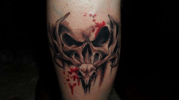 two skulls tattoo