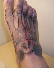Foot tattoo, skull and bones tattoo