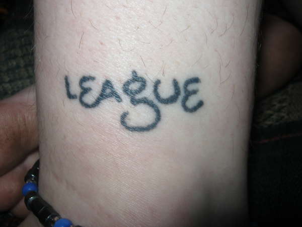 League (left outside ankle) tattoo