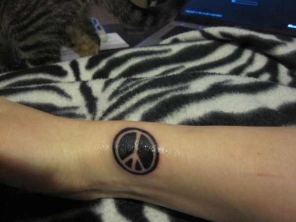 Peace sign tattoo