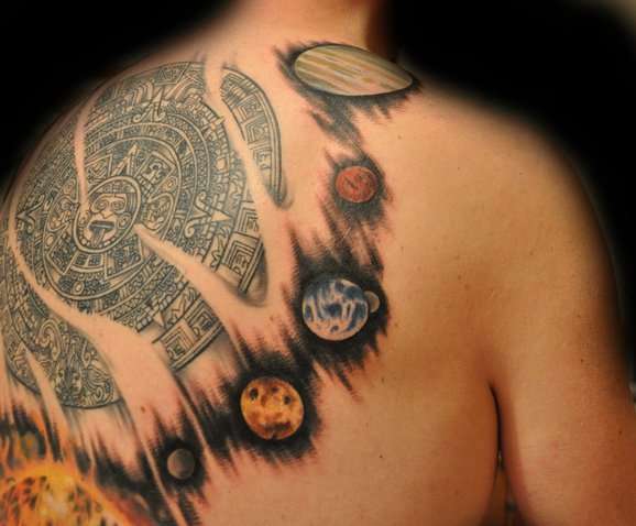 Myan calendar surrounded by solar system tattoo