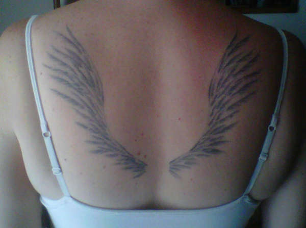Wings on back tattoo