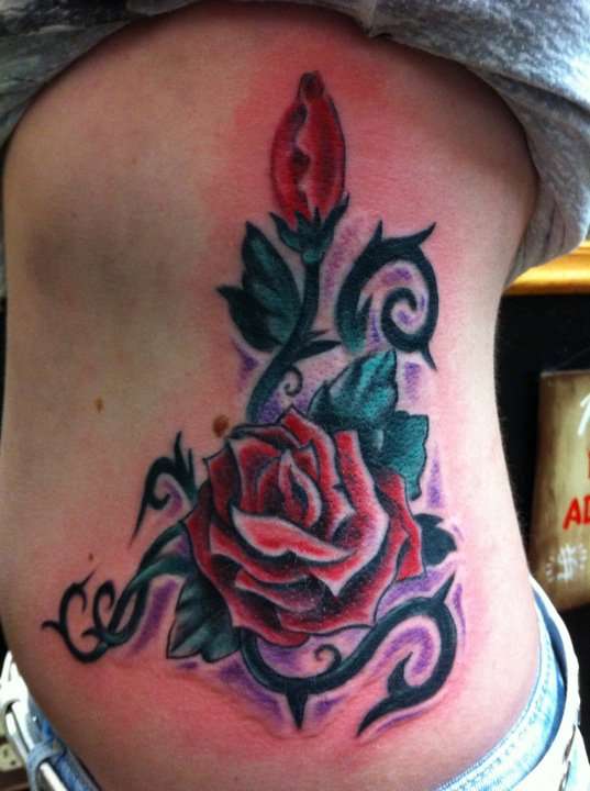 ribs roses tattoo
