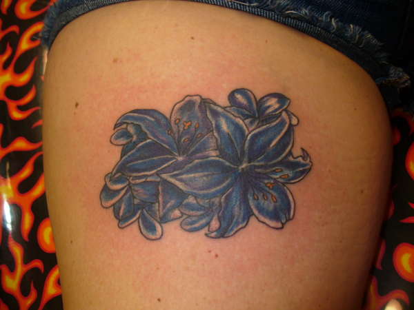 Flower cover-up tattoo