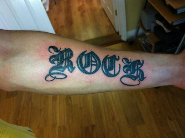 My first tattoo. ( FYI Thats my last name) tattoo