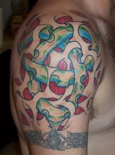 Bio-mech trinity knot tattoo
