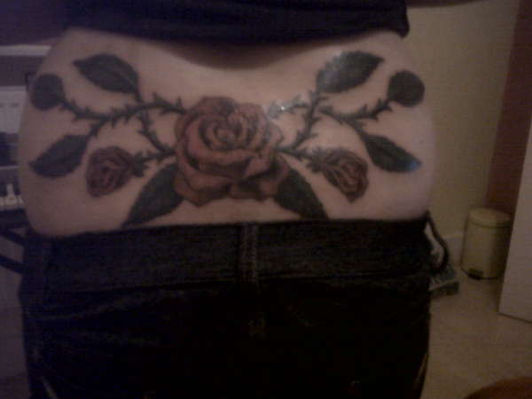 roses on my lower back tattoo