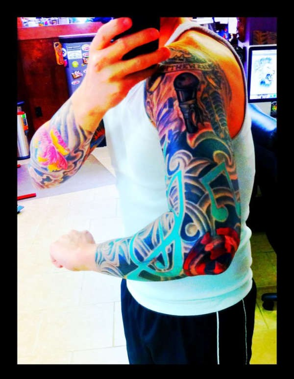 Left Arm Music Sleeve side view tattoo