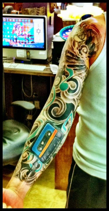 Left Arm Music Sleeve tattoo