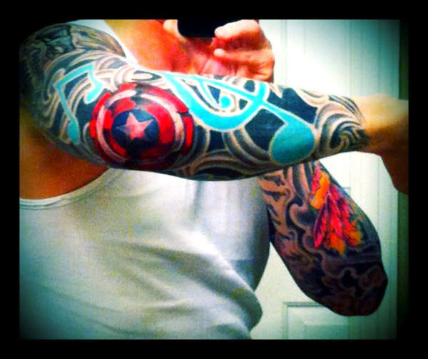 Left arm elbow Captain America Shield tattoo