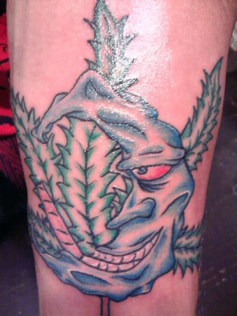 Moon and pot leaf tattoo