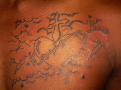 Sacred heart w/ cross and clouds tattoo