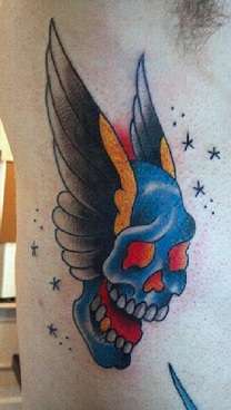 Skull with wings tattoo